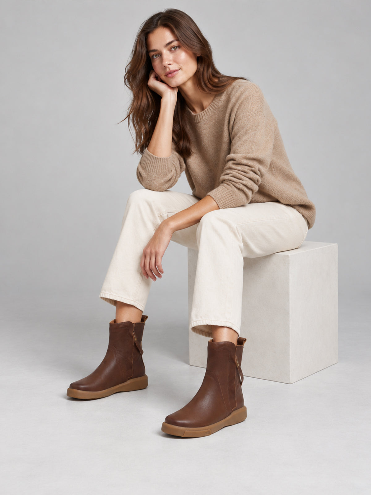 Brown double-zip leather boots, shown as part of a complete outfit.