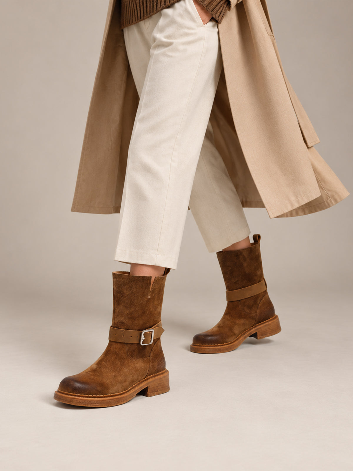 Brown Spanish-inspired buckle boots, close-up of the shoes being worn.