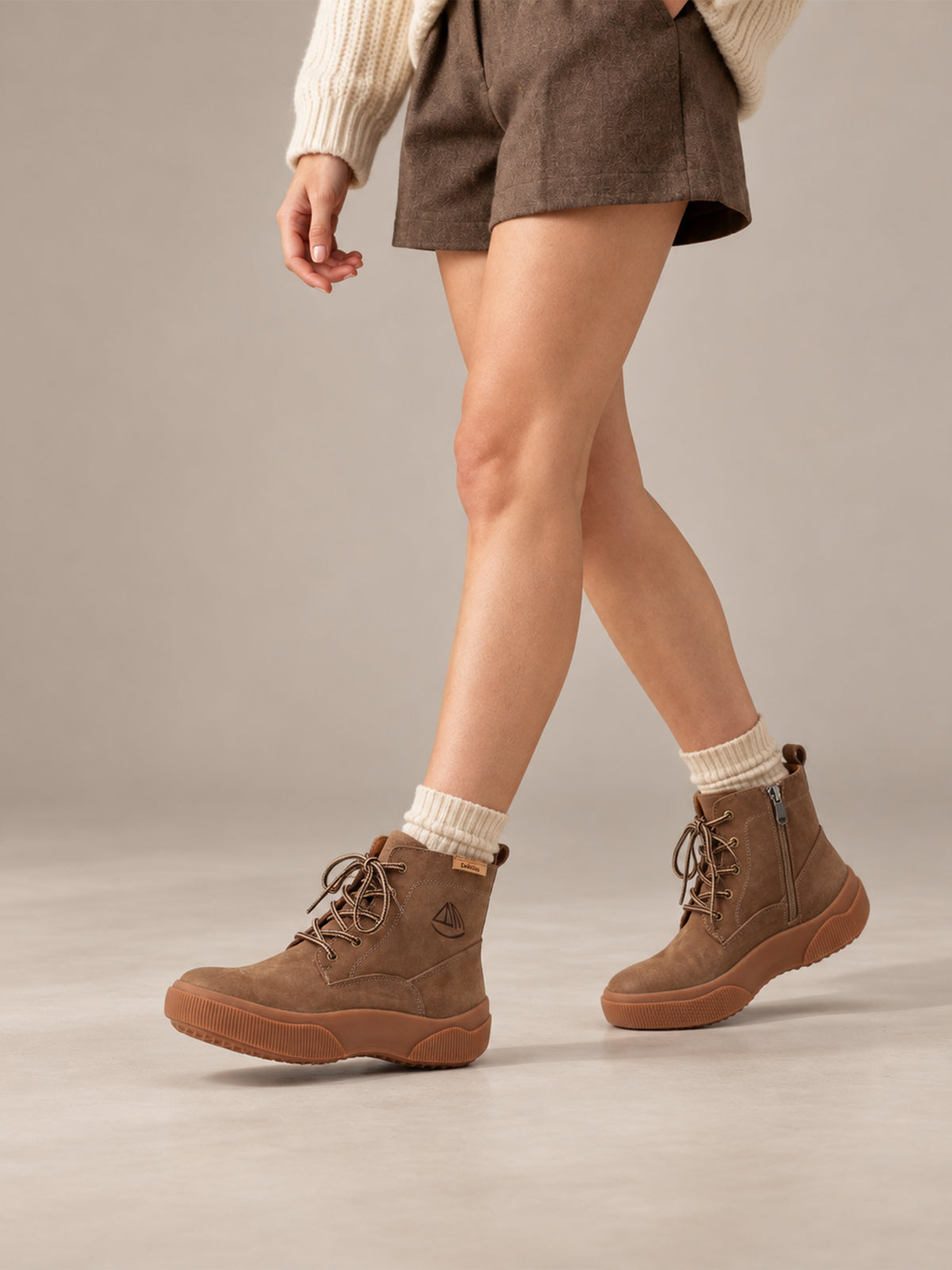 Brown Yaoyao sole ankle boots, close-up of the shoes being worn.