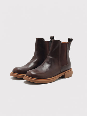 Dark brown washed-leather Chelsea boots, pair viewed from the front at an angle.