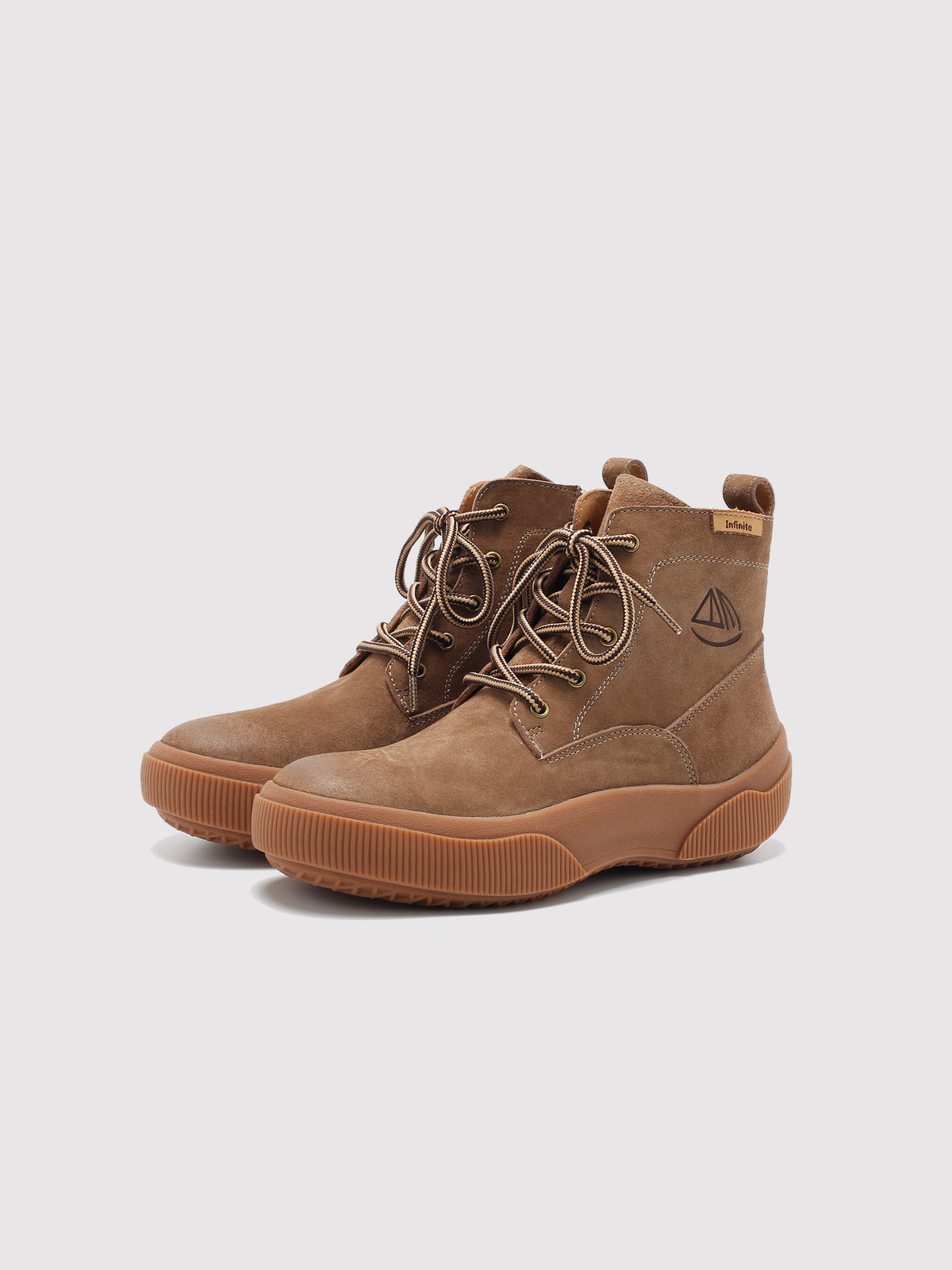 Brown Yaoyao sole ankle boots, pair viewed from the front at an angle.