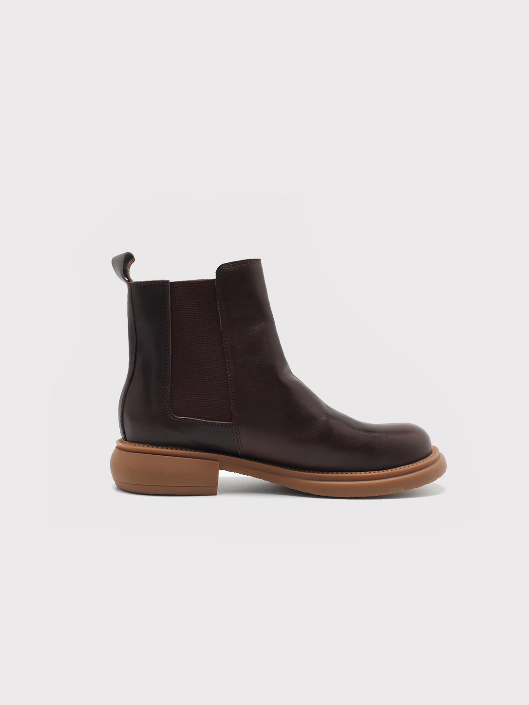Dark brown washed-leather Chelsea boots, side profile.