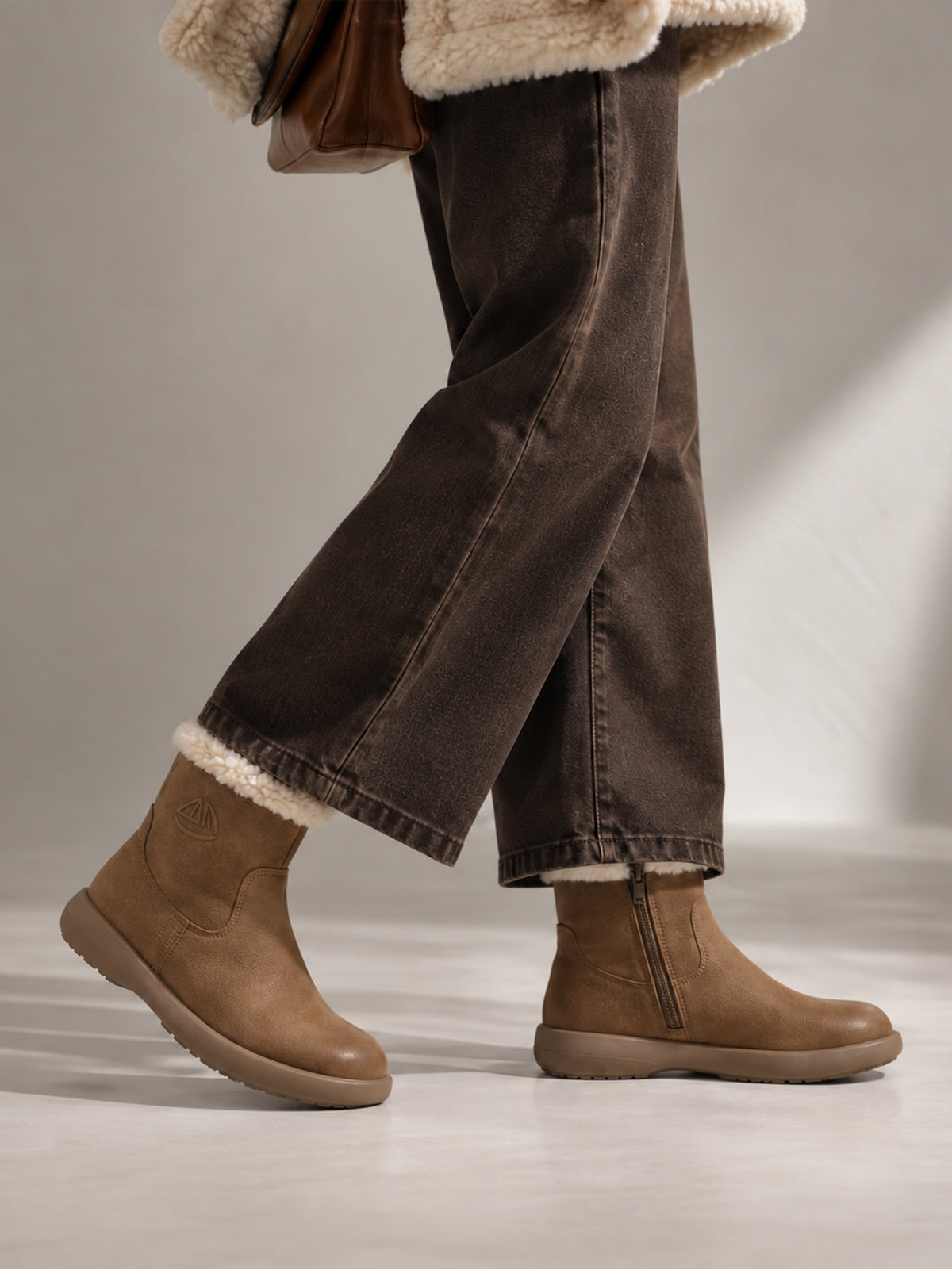 Coffee brown Snow-Cap snow boots, close-up of the shoes being worn.