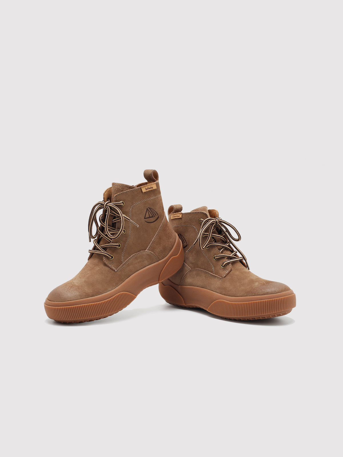 Brown Yaoyao sole ankle boots, pair arranged at different angles.