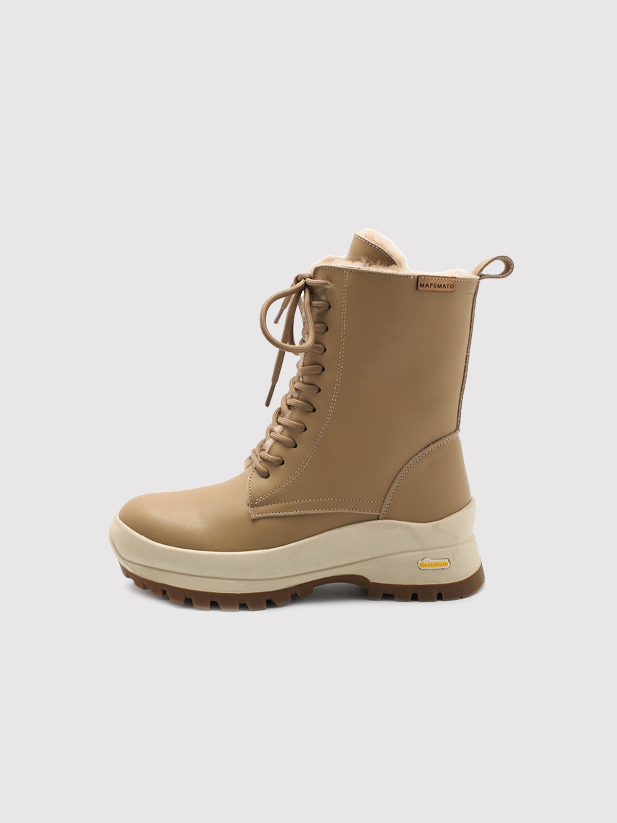 Beige Aspen shearling lace-up boots, side profile.
