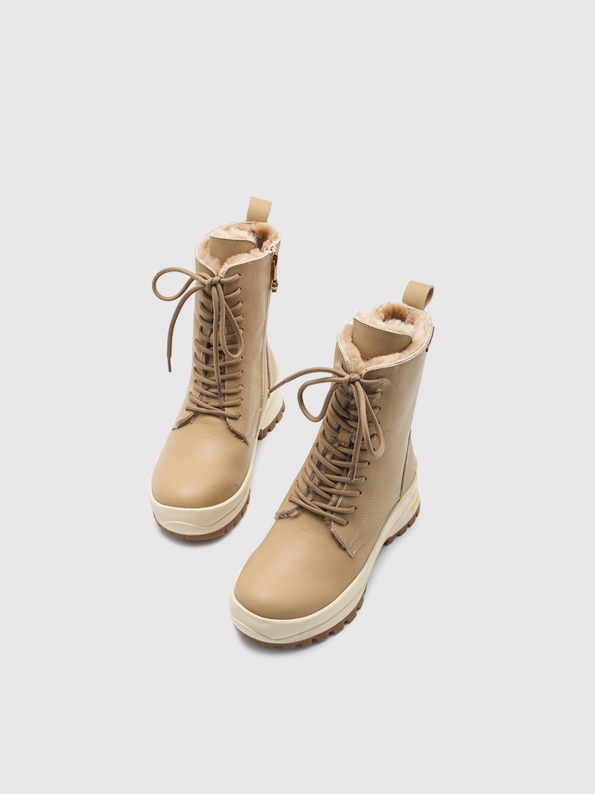 Beige Aspen shearling lace-up boots, pair viewed from above at an angle.