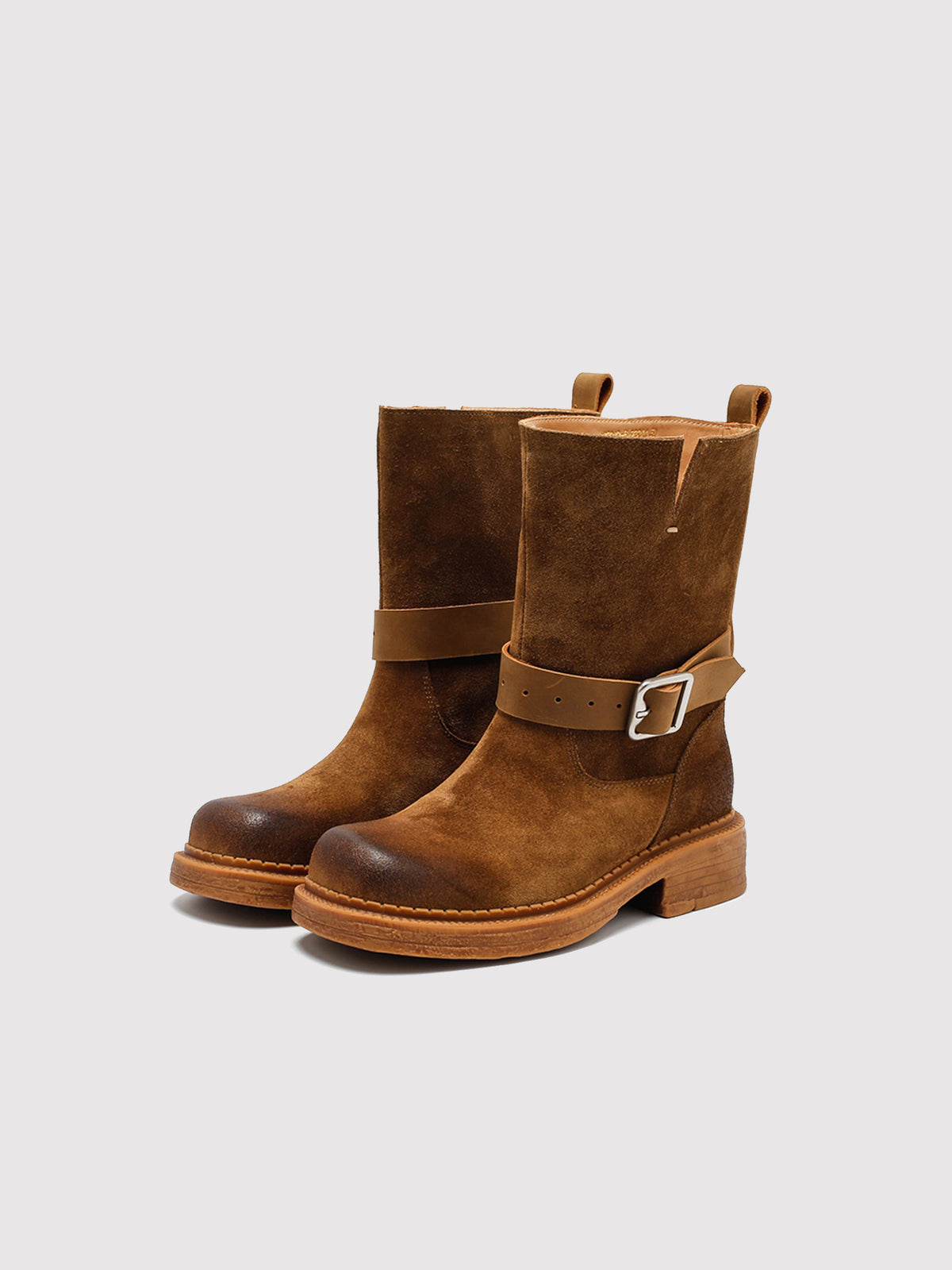 Brown Spanish-inspired buckle boots, pair viewed from the front at an angle.