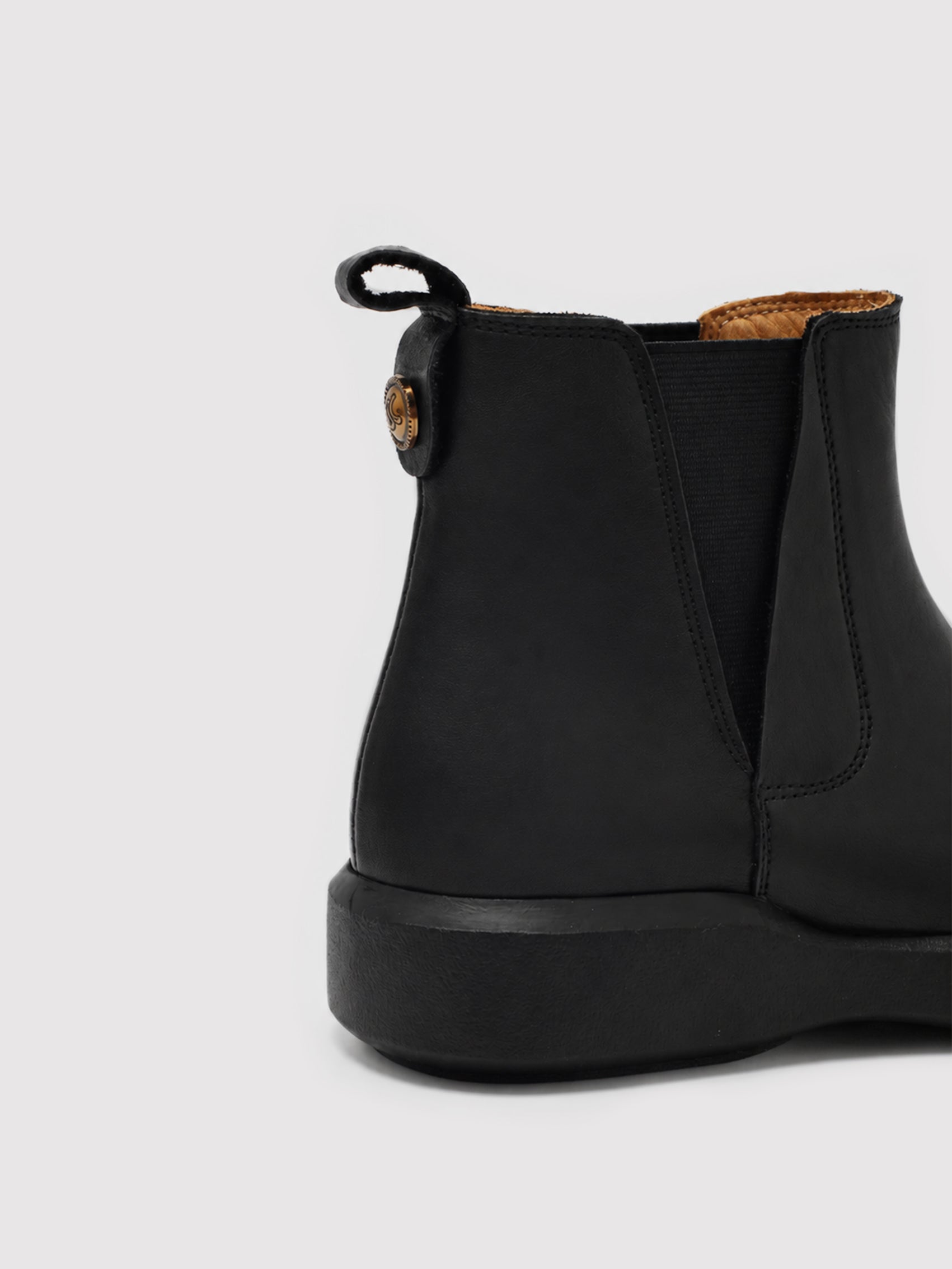 Chunky-Sole Black Leather Chelsea Boots with Decorative Gold Accent
