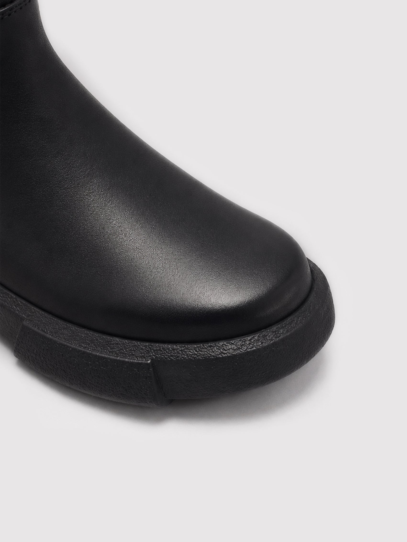 Minimalist Black Leather Ankle Boots with Decorative Strap