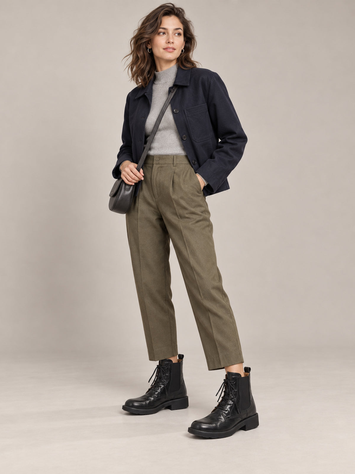 Vegetable-tanned black lace-up boots, shown as part of a complete outfit.