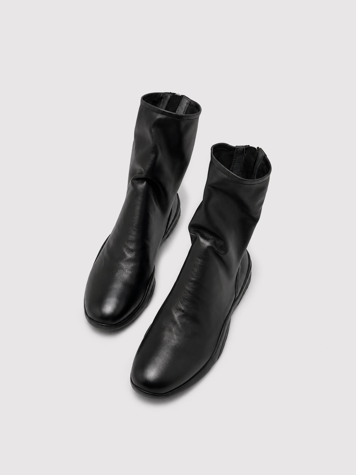 Black lambskin sock boots, pair viewed from above.