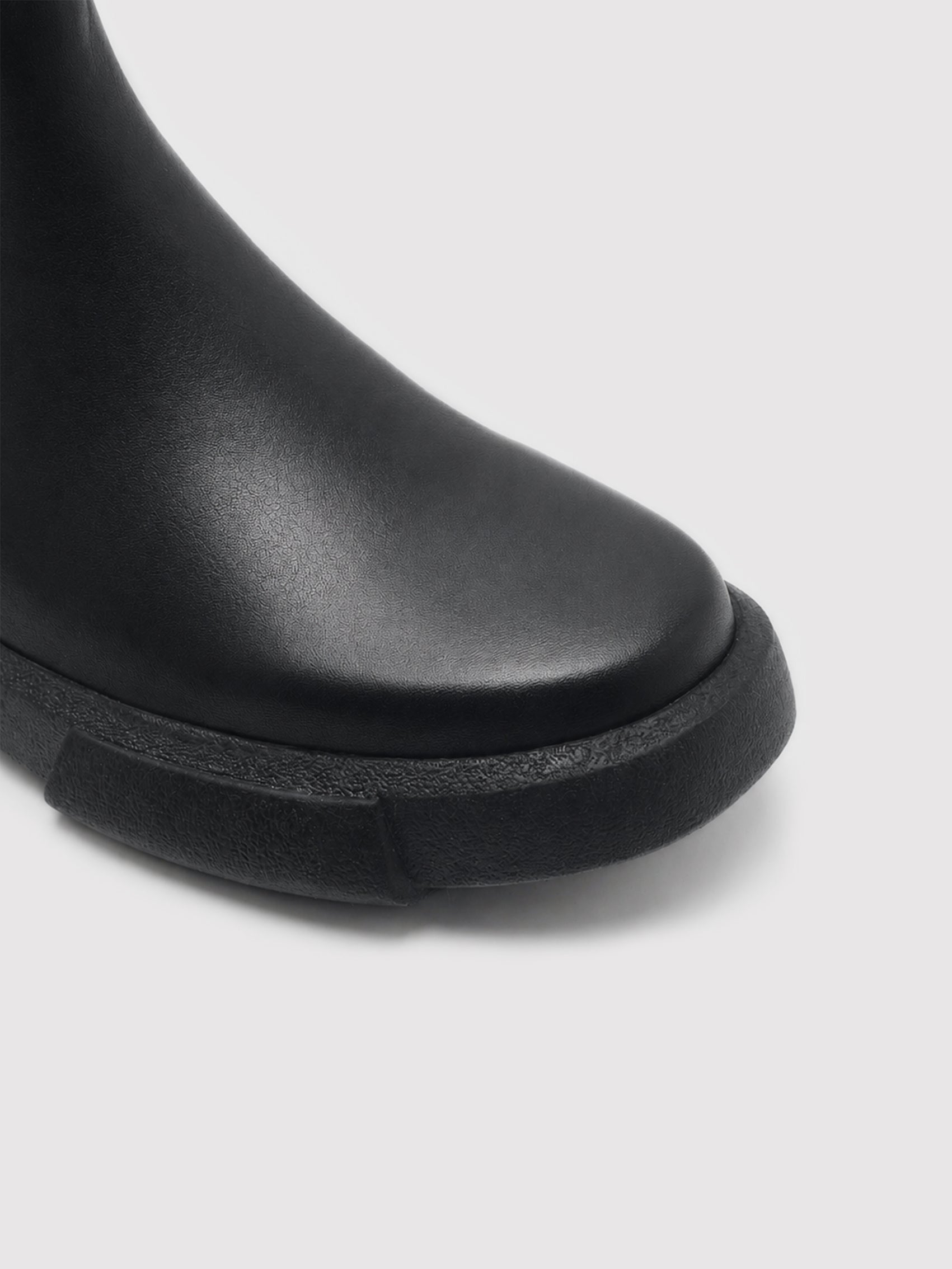 Chunky-Sole Black Leather Chelsea Boots with Decorative Gold Accent
