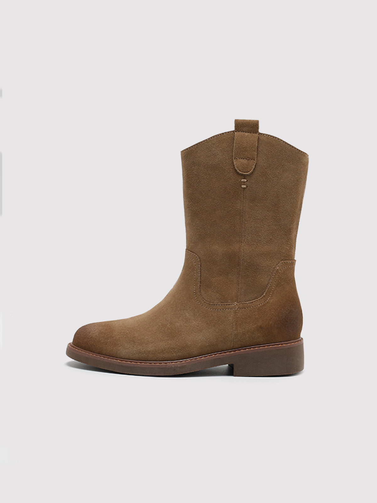 Tan pointed-toe boots, side profile.