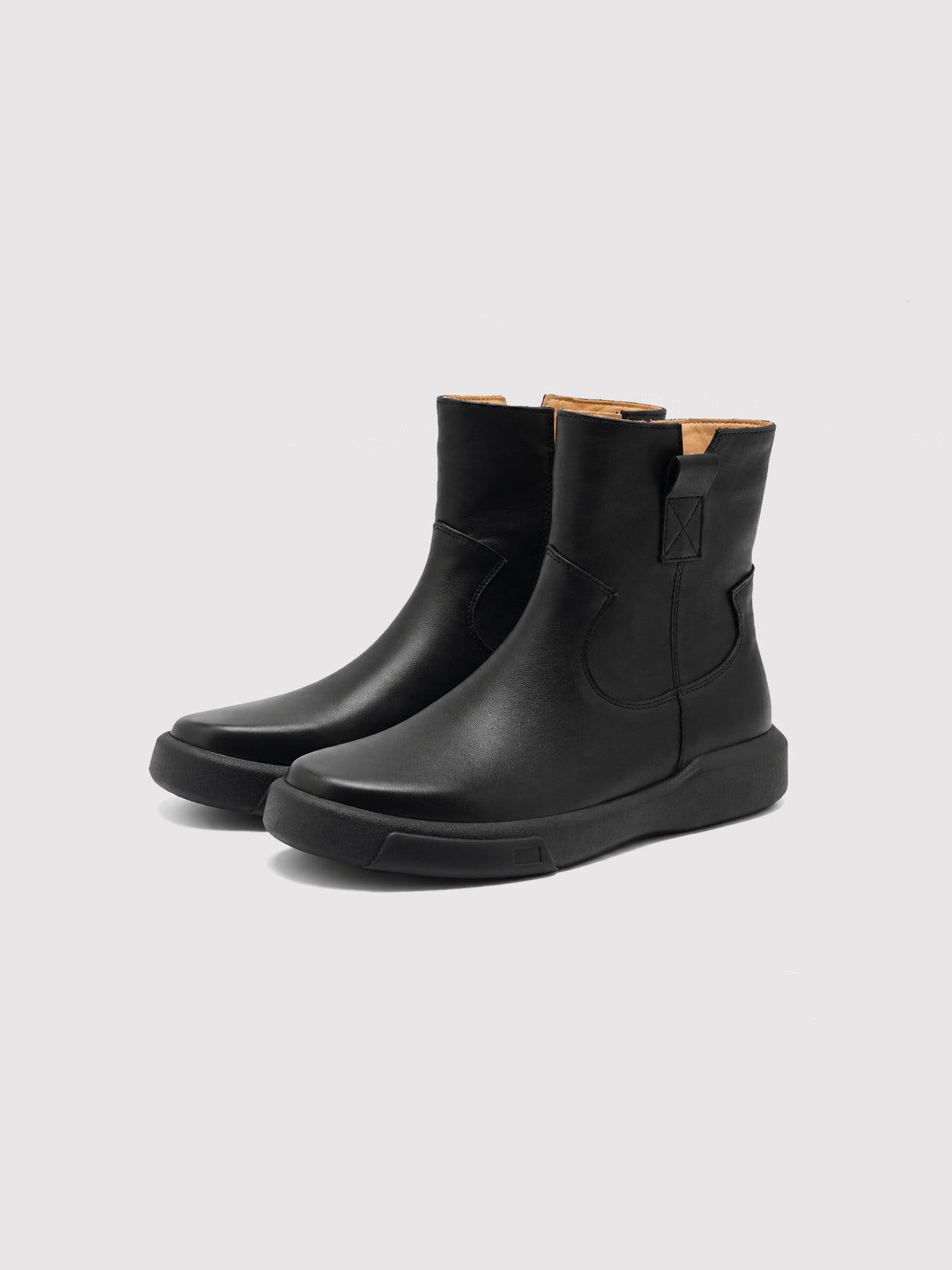 Black zip ankle boots, pair viewed from the front at an angle.
