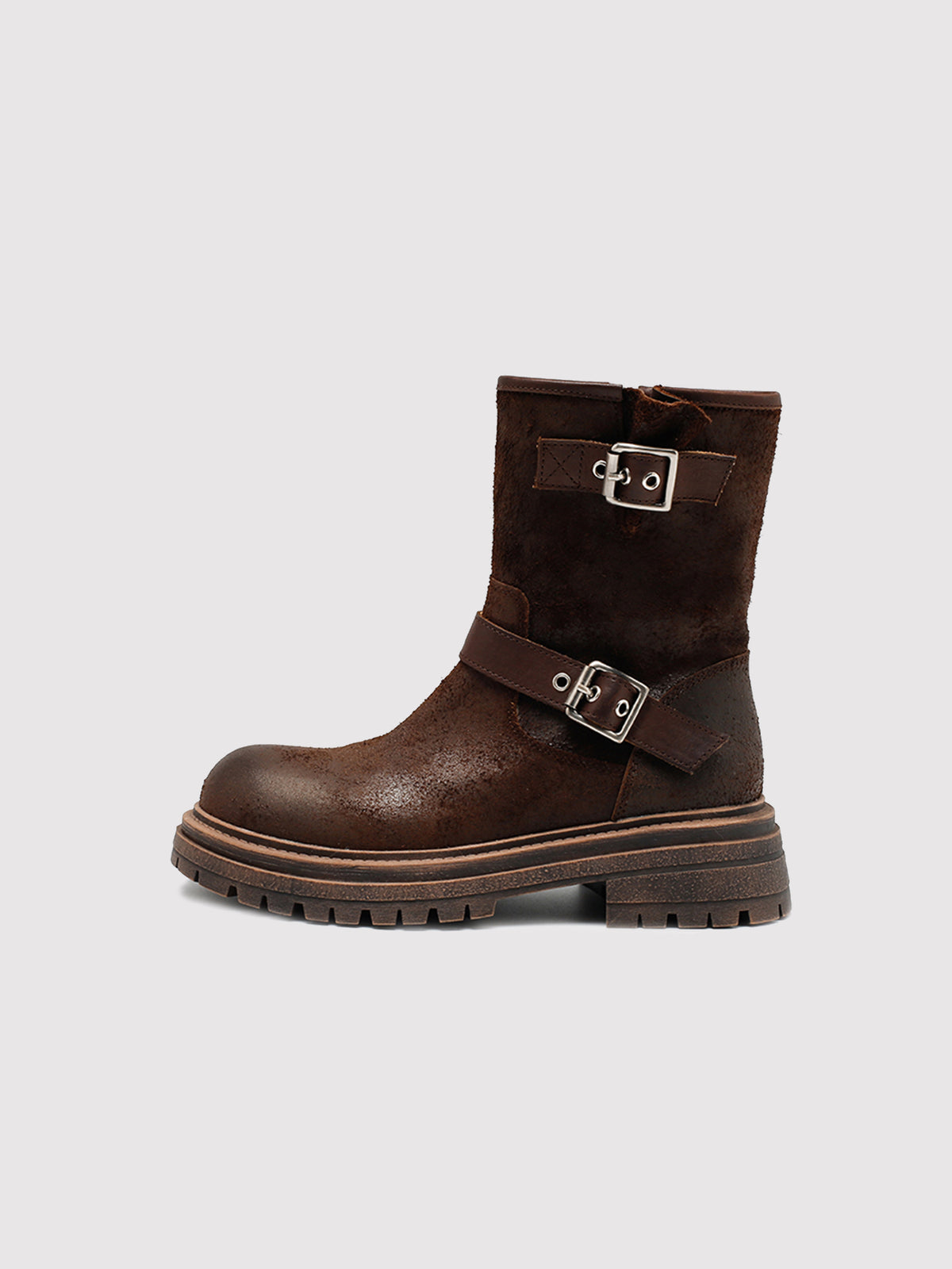 Brown reverse-leather buckle boots, side profile.