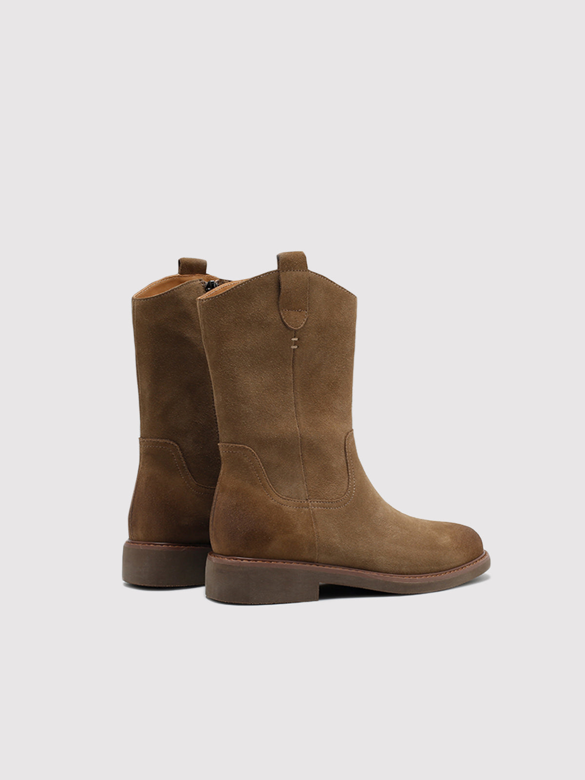 Tan pointed-toe boots, pair viewed from the back.