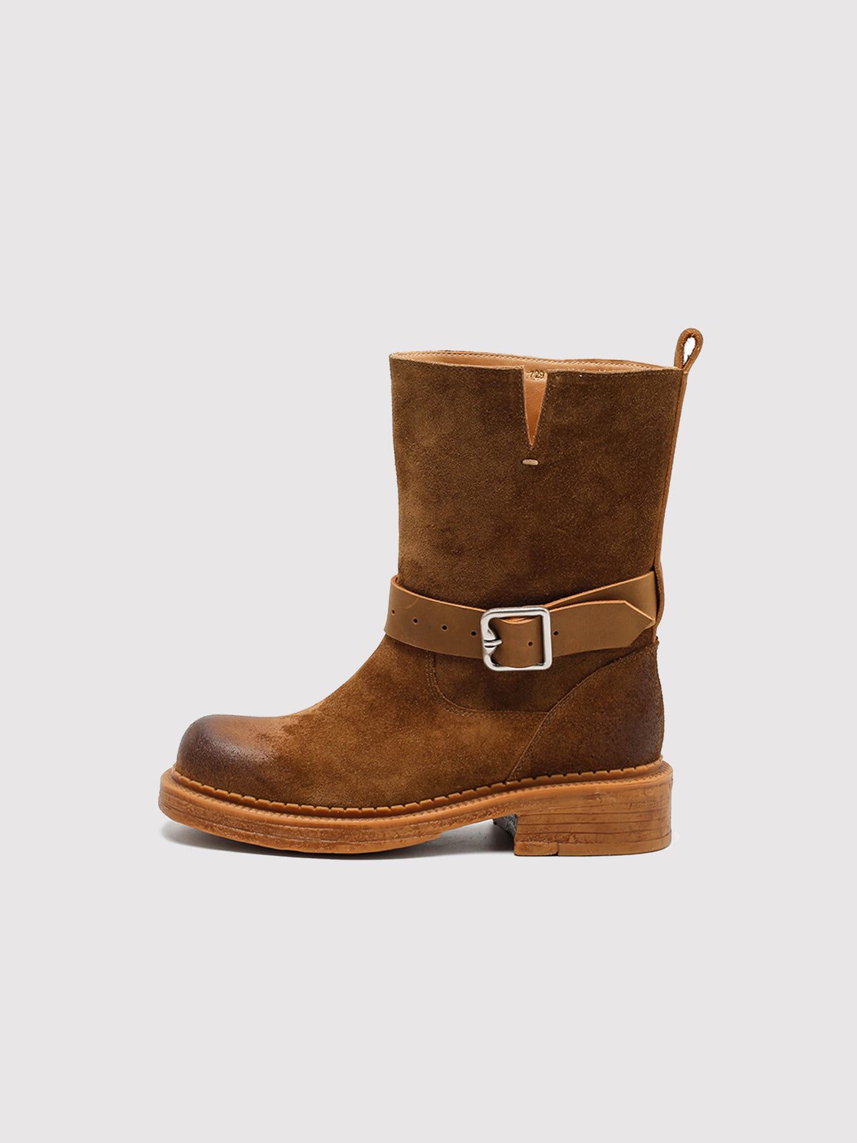 Brown Spanish-inspired buckle boots, side profile.