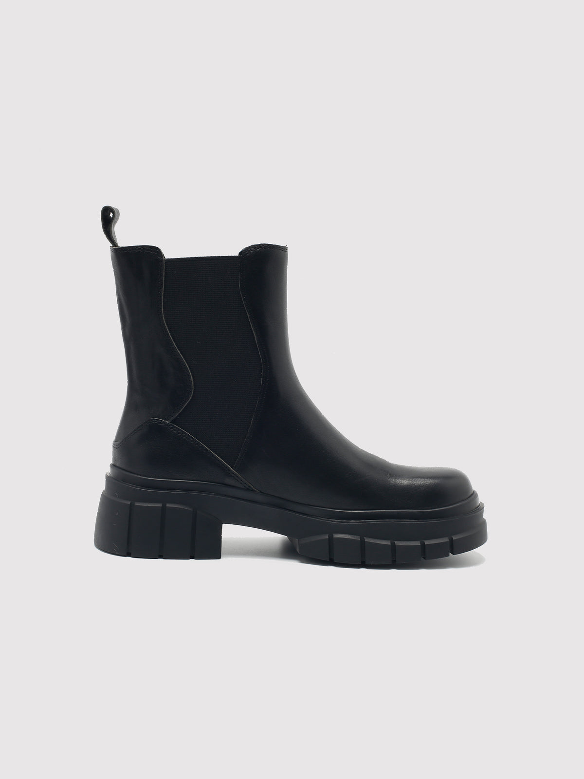 Black shaft boots with lug soles, side profile.