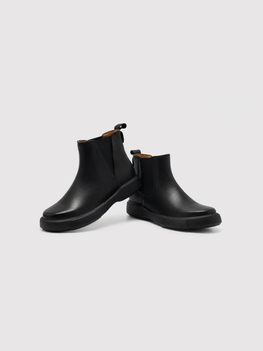 Chunky-Sole Black Leather Chelsea Boots with Decorative Gold Accent