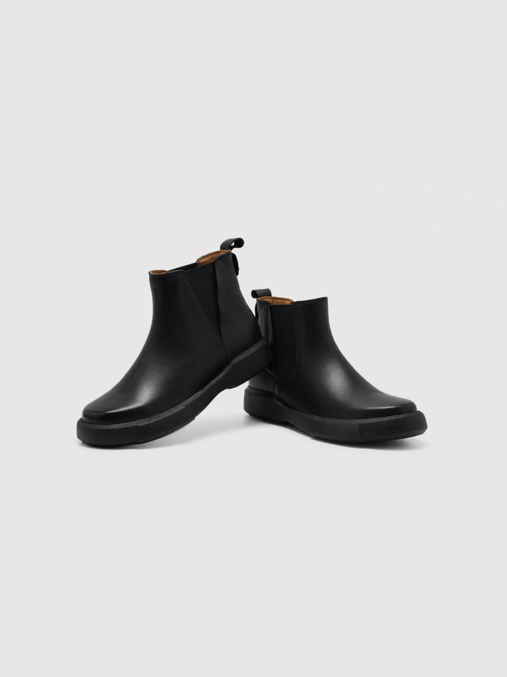 Chunky-Sole Black Leather Chelsea Boots with Decorative Gold Accent