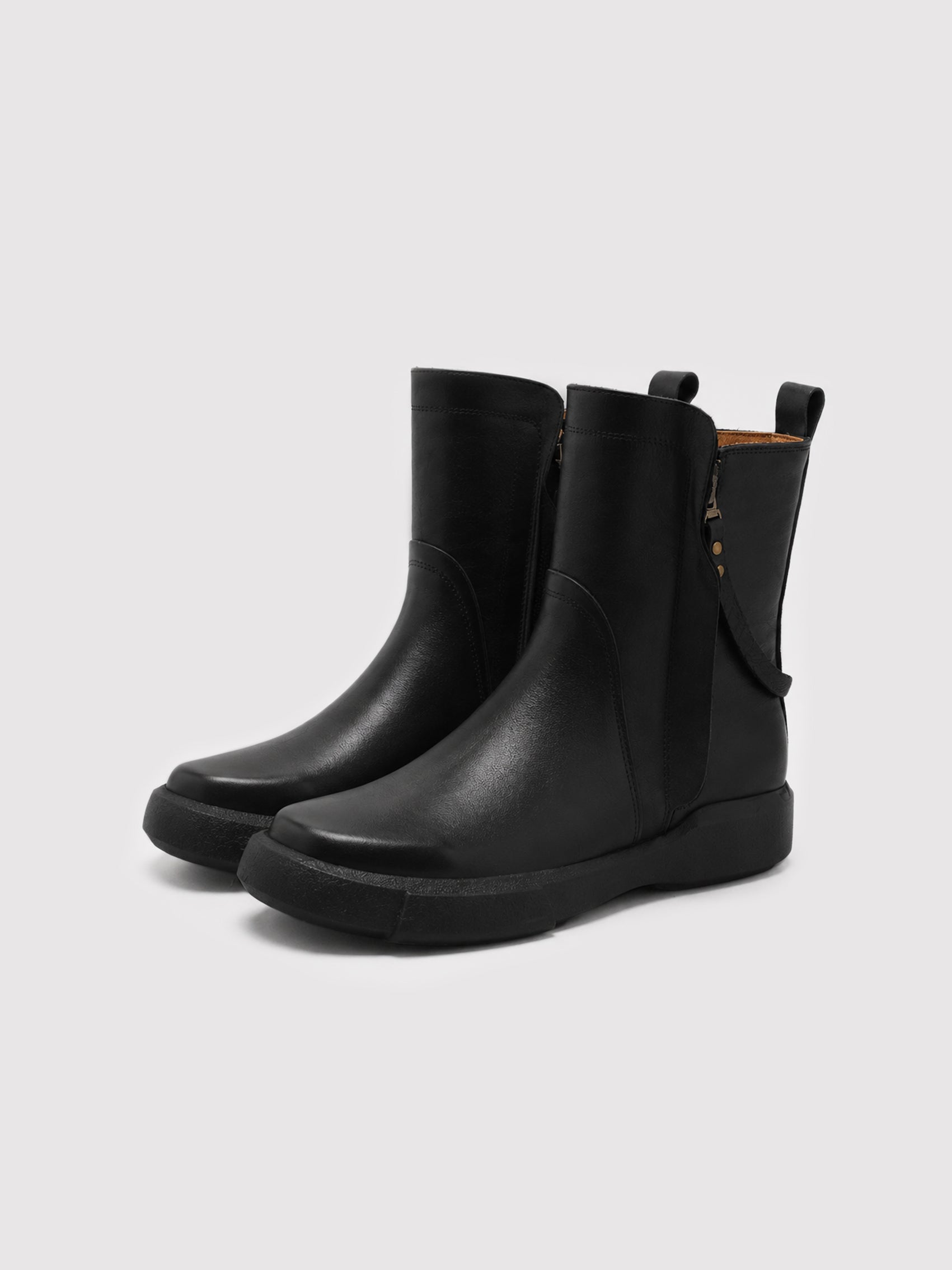 Minimalist Black Leather Ankle Boots with Decorative Strap