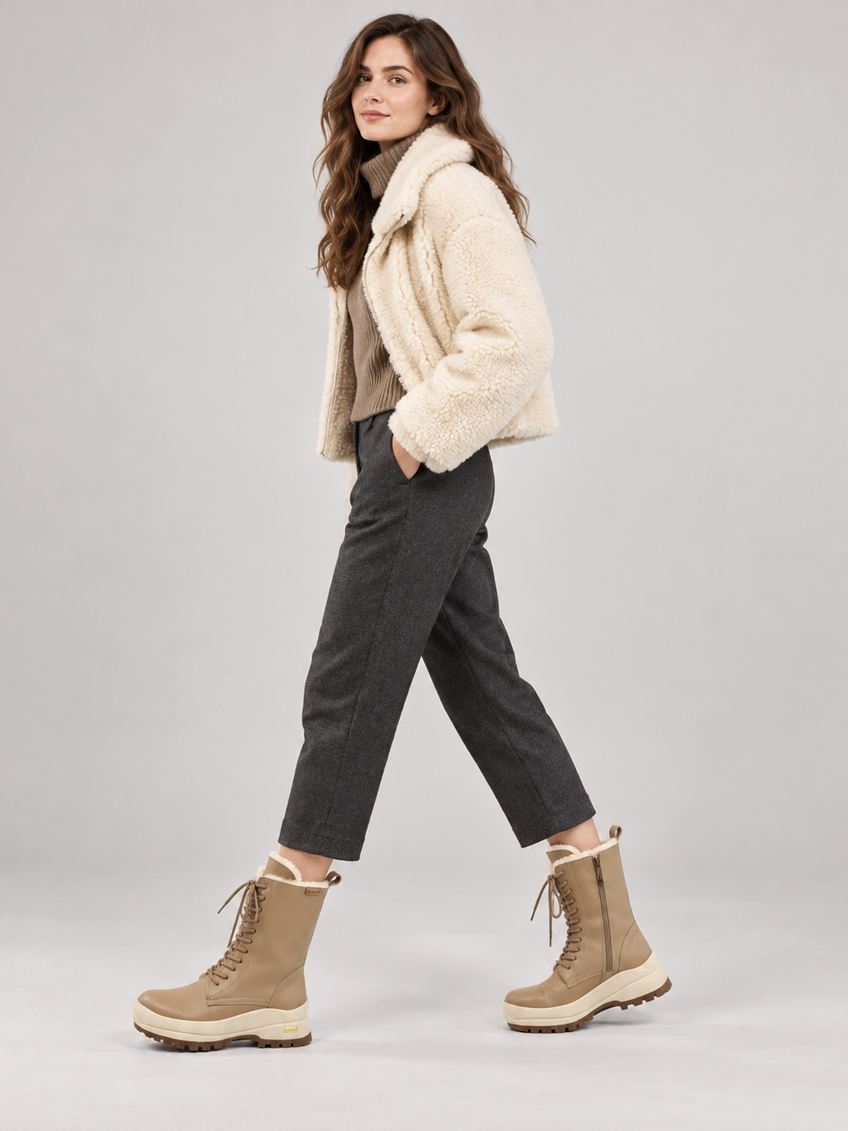 Beige Aspen shearling lace-up boots, shown as part of a complete outfit.