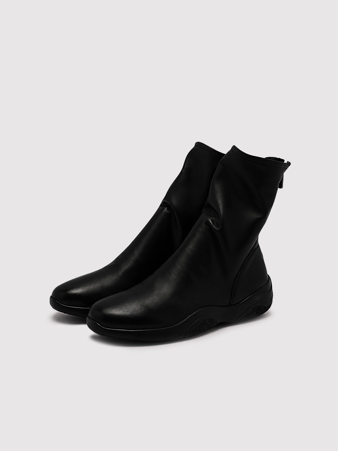 Black lambskin sock boots, pair viewed from the front at an angle.