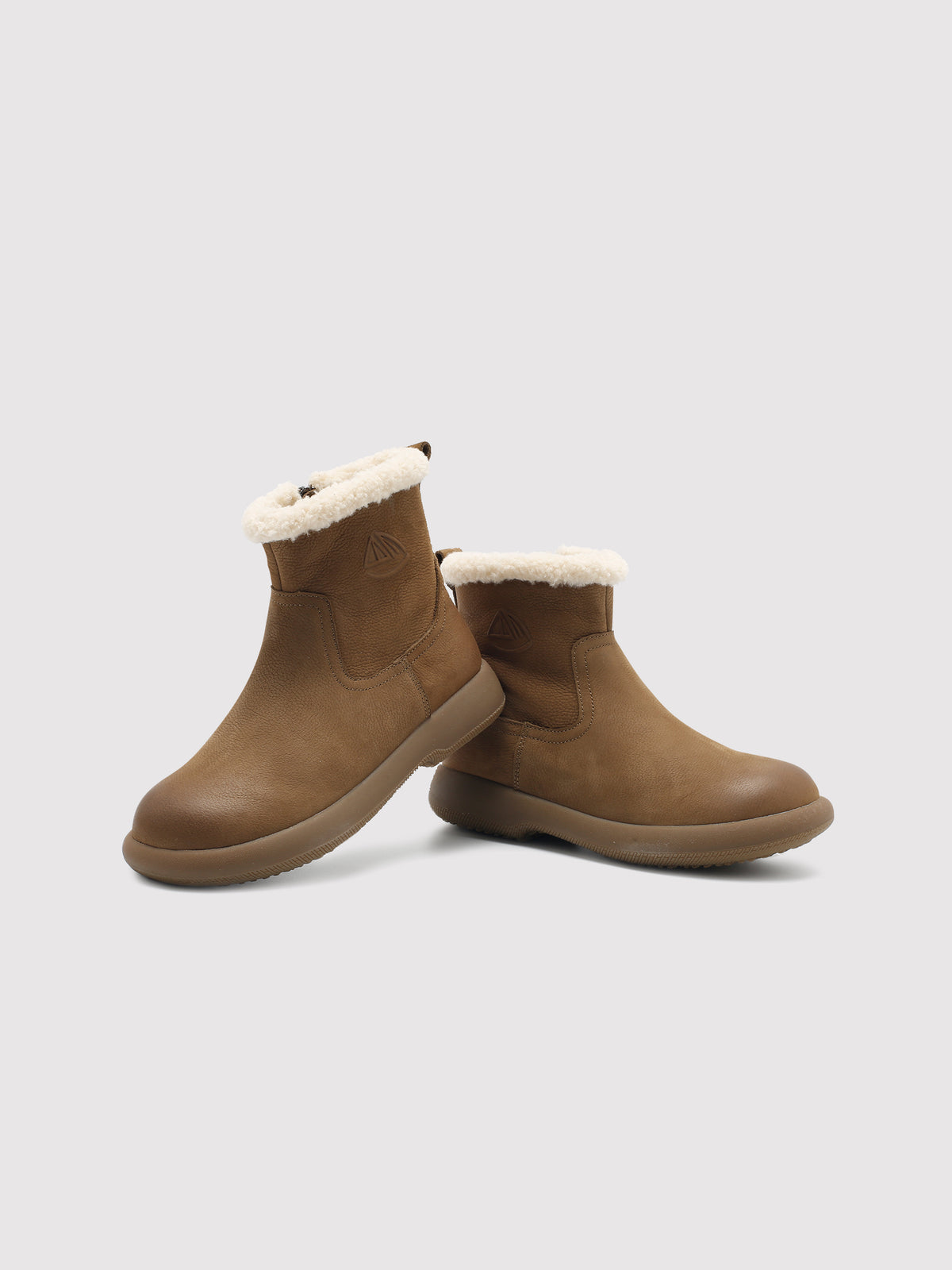 Coffee brown Snow-Cap snow boots, pair arranged at different angles.