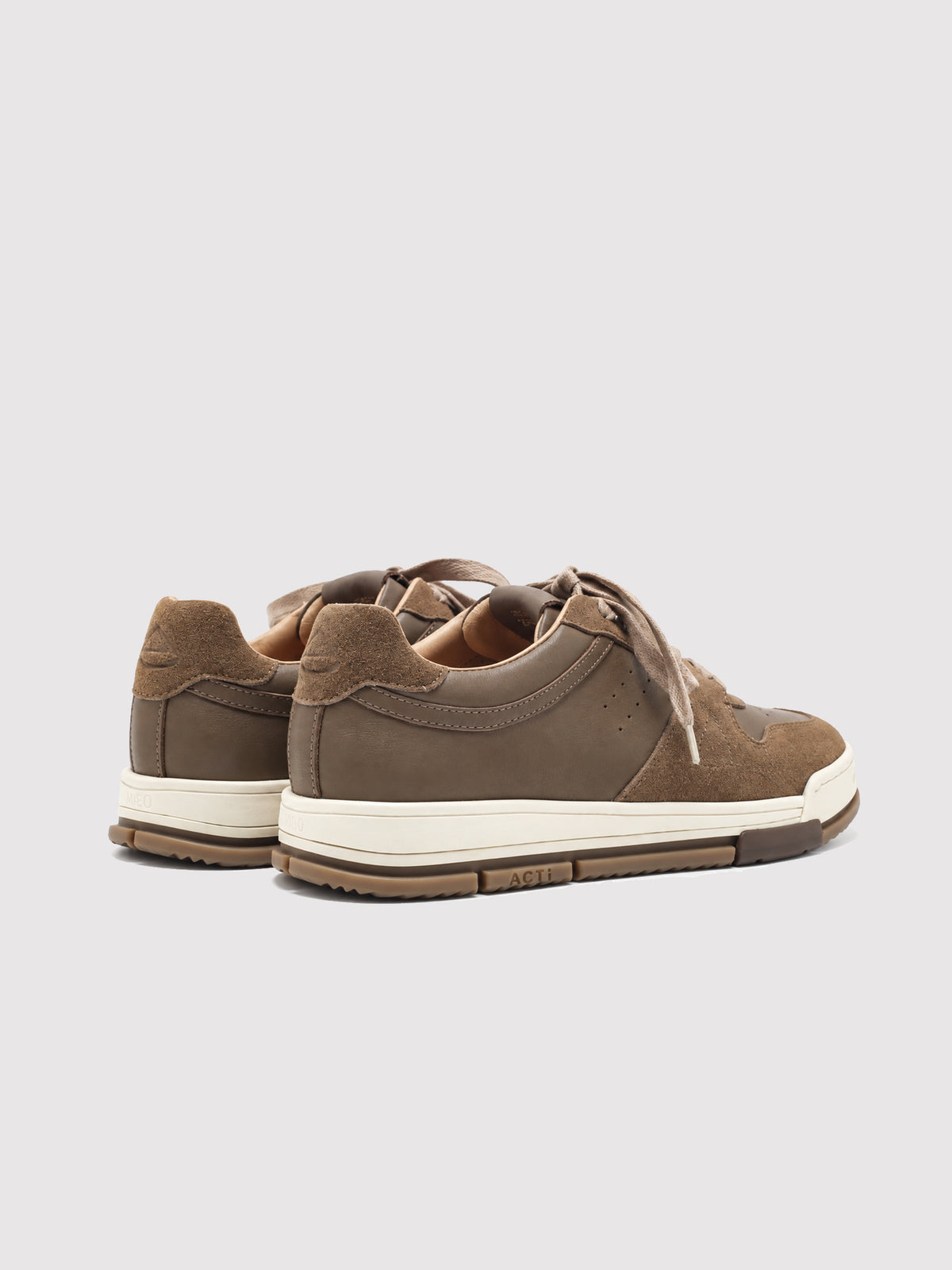 Rear view of a pair of brown sneakers.