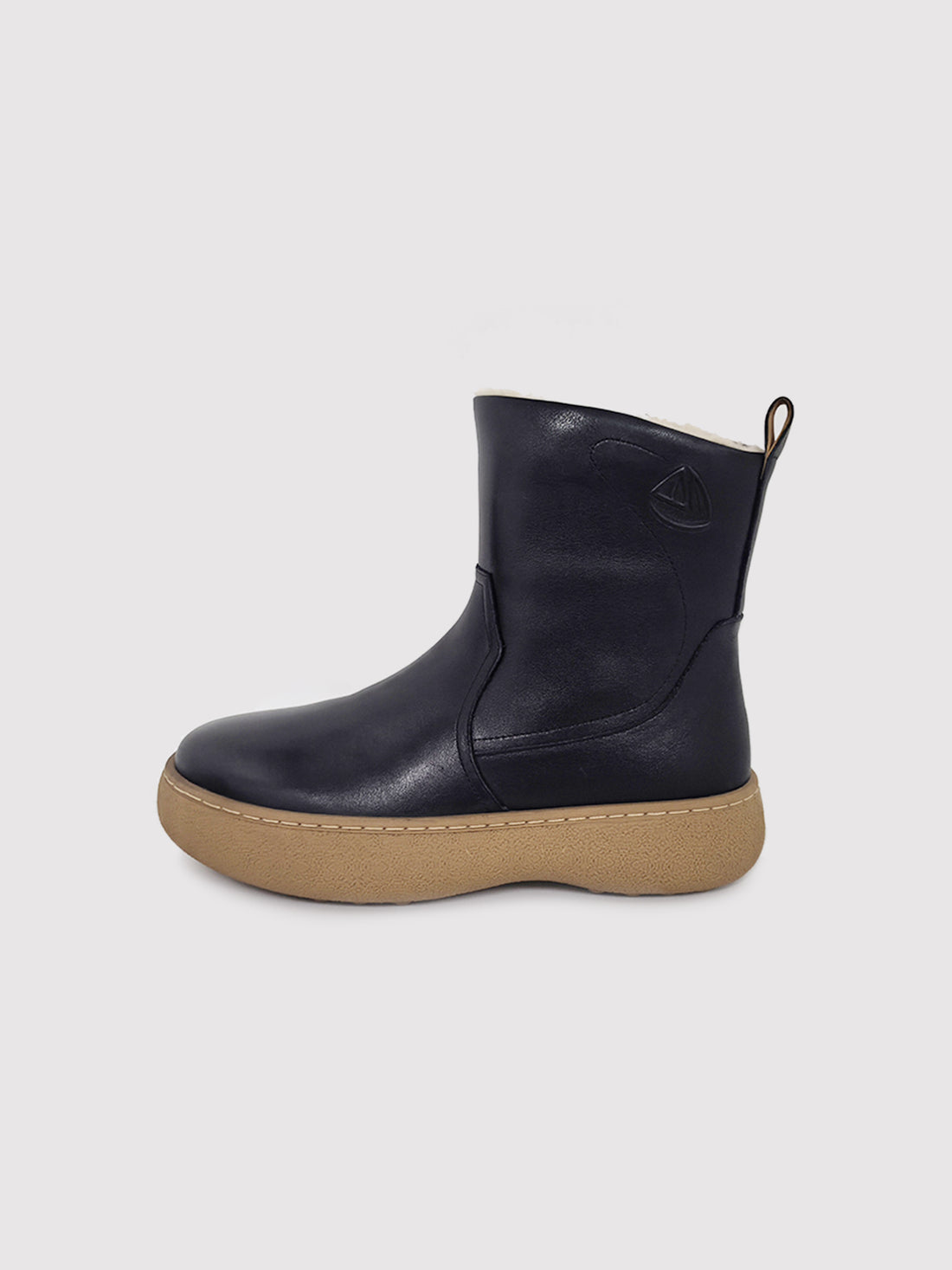 Black polished winter boots with tan soles, pair viewed from the front at an angle.