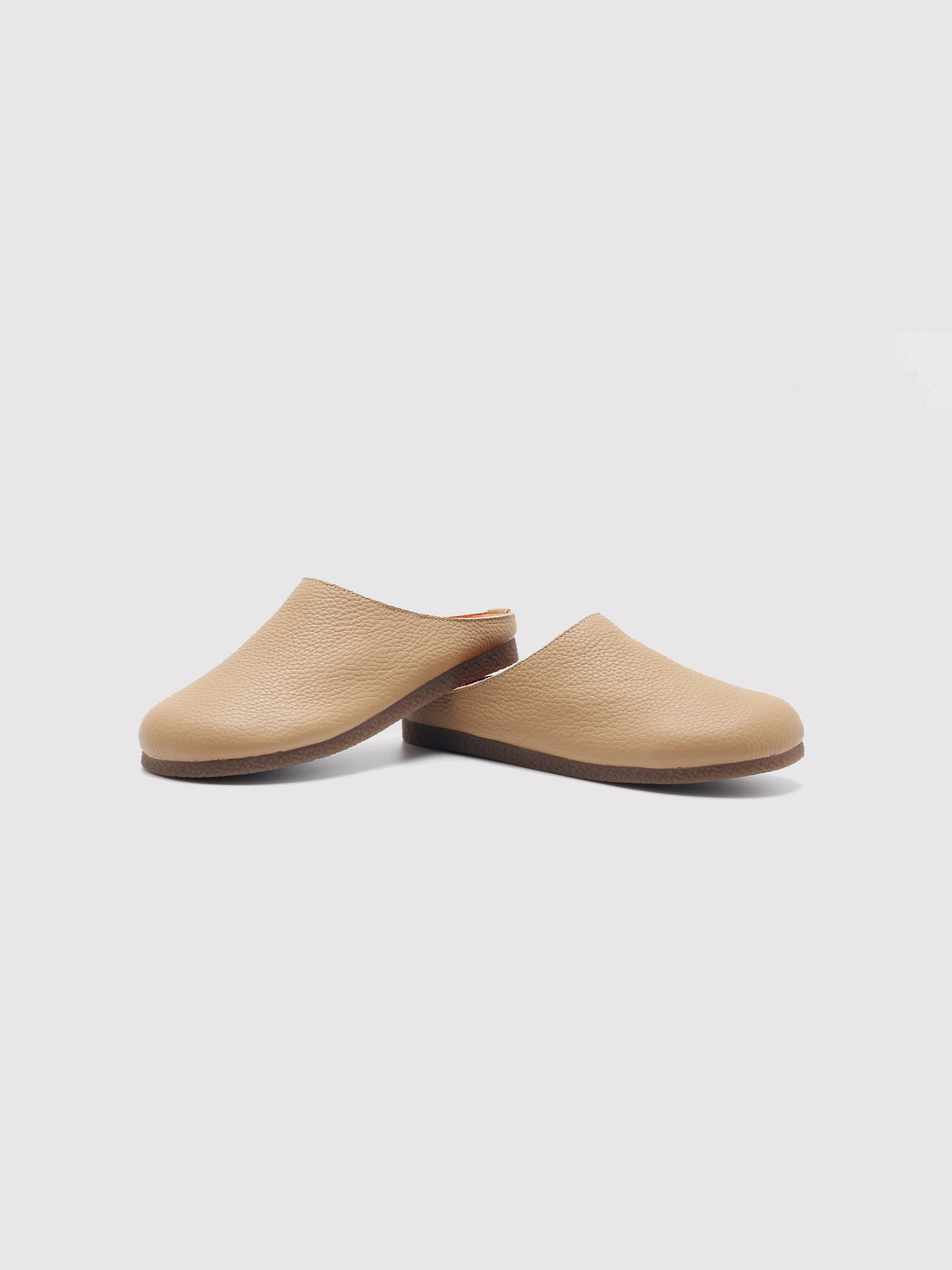Beige Chestnut leather mules, pair viewed from the front at an angle.