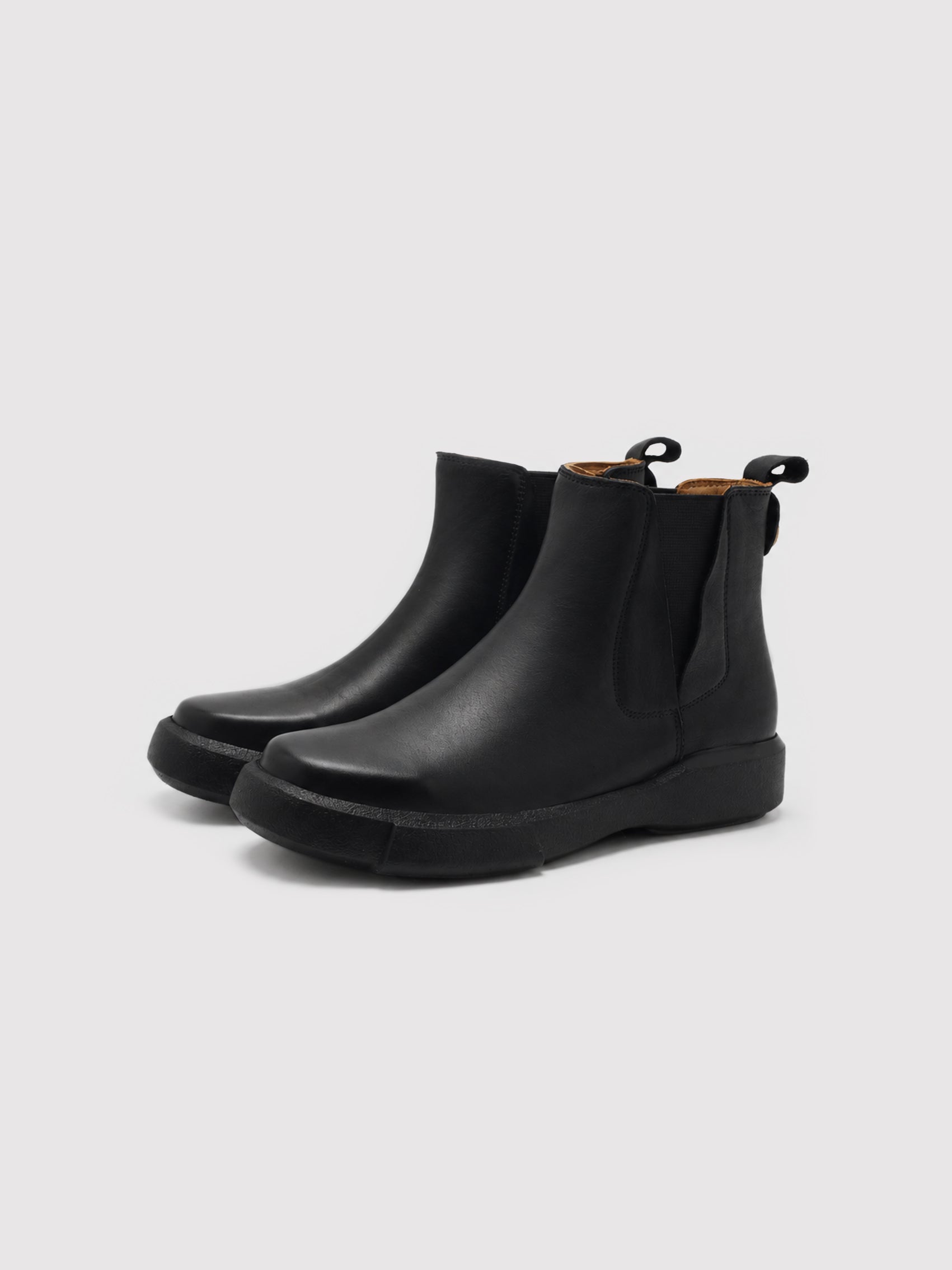 Chunky-Sole Black Leather Chelsea Boots with Decorative Gold Accent