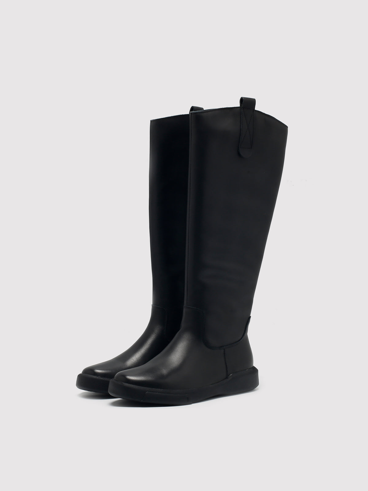 Black fleece-lined knee-high boots, pair viewed from the front at an angle.
