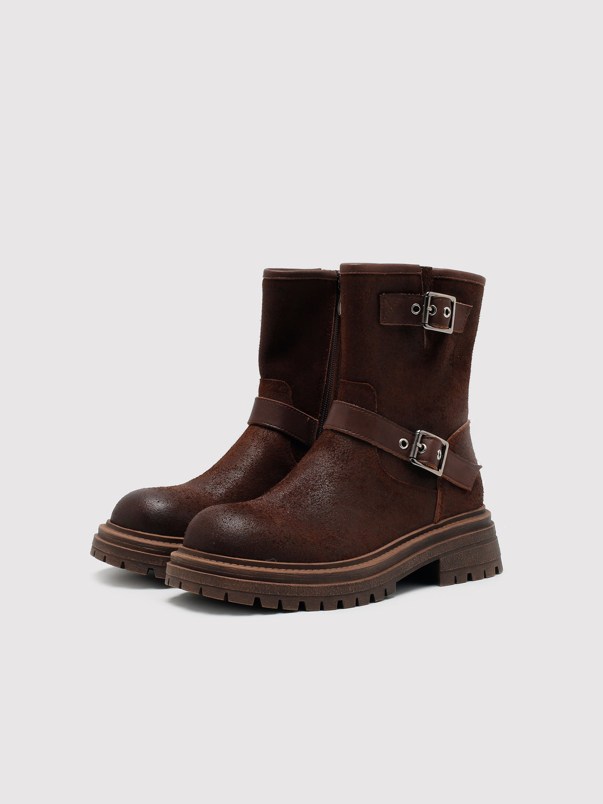 Brown reverse-leather buckle boots, pair viewed from the front at an angle.