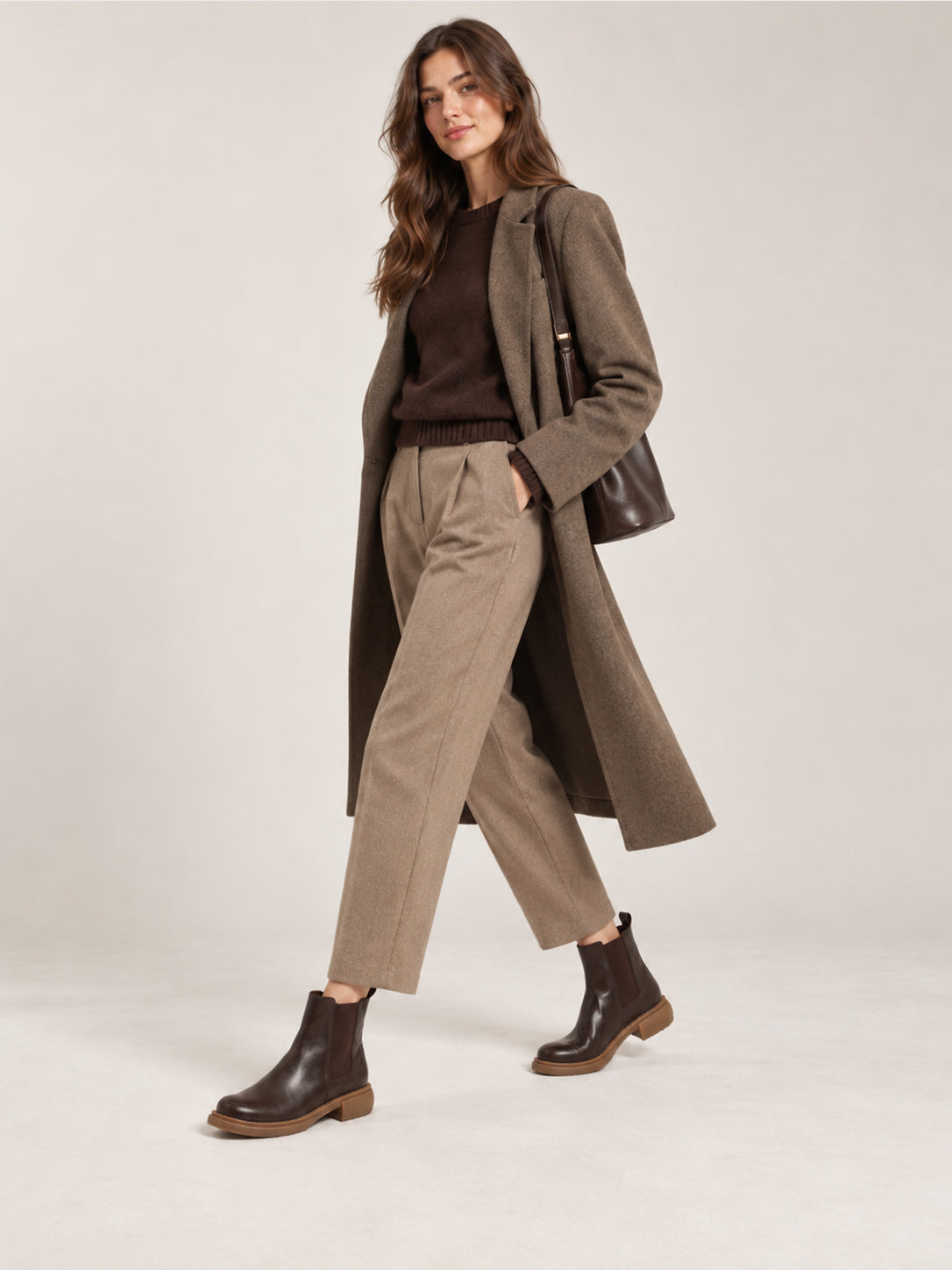 Dark brown washed-leather Chelsea boots, shown as part of a complete outfit.
