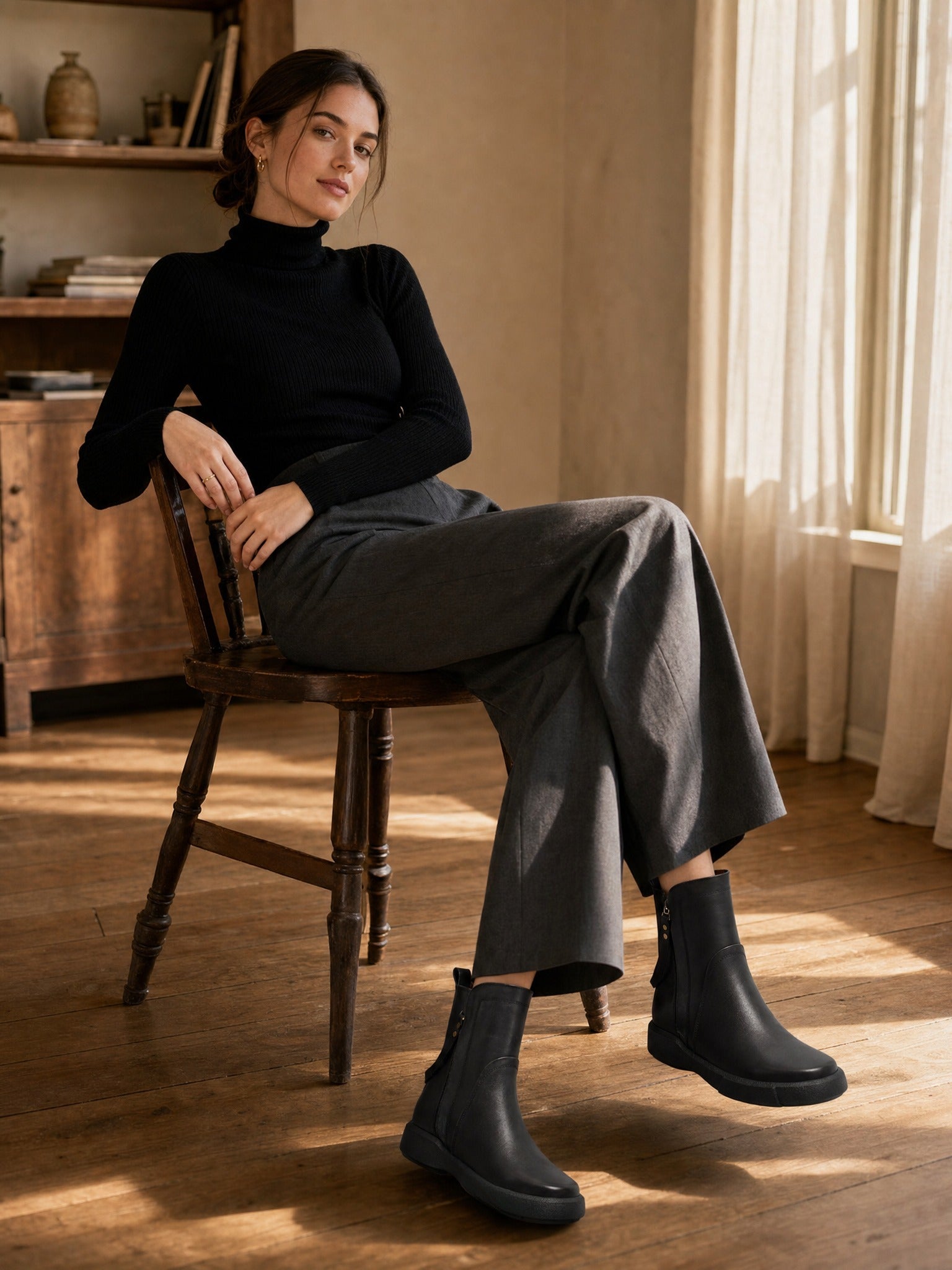 Minimalist Black Leather Ankle Boots with Decorative Strap