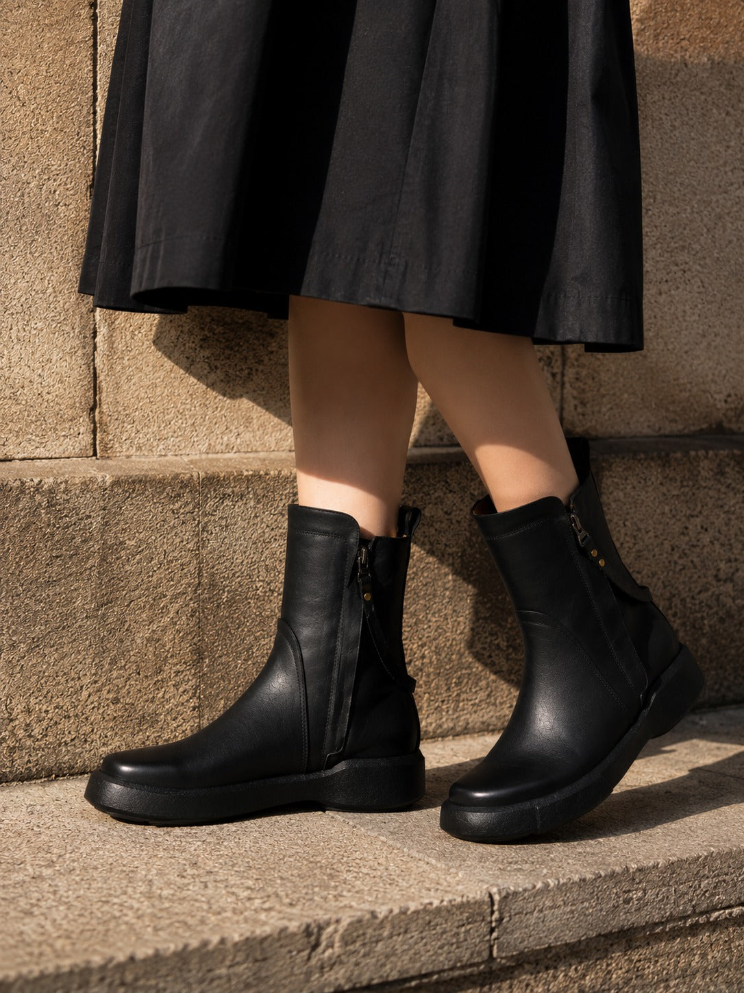 Minimalist Black Leather Ankle Boots with Decorative Strap