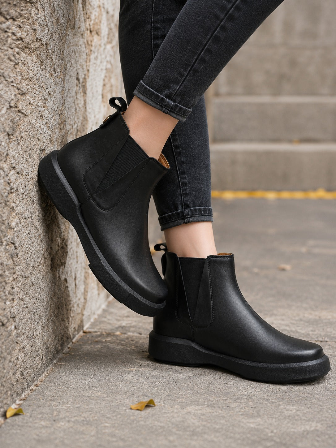 Chunky-Sole Black Leather Chelsea Boots with Decorative Gold Accent